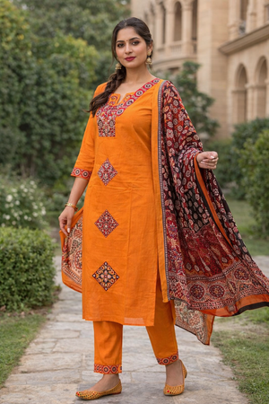 Woman in traditional orange outfit in garden